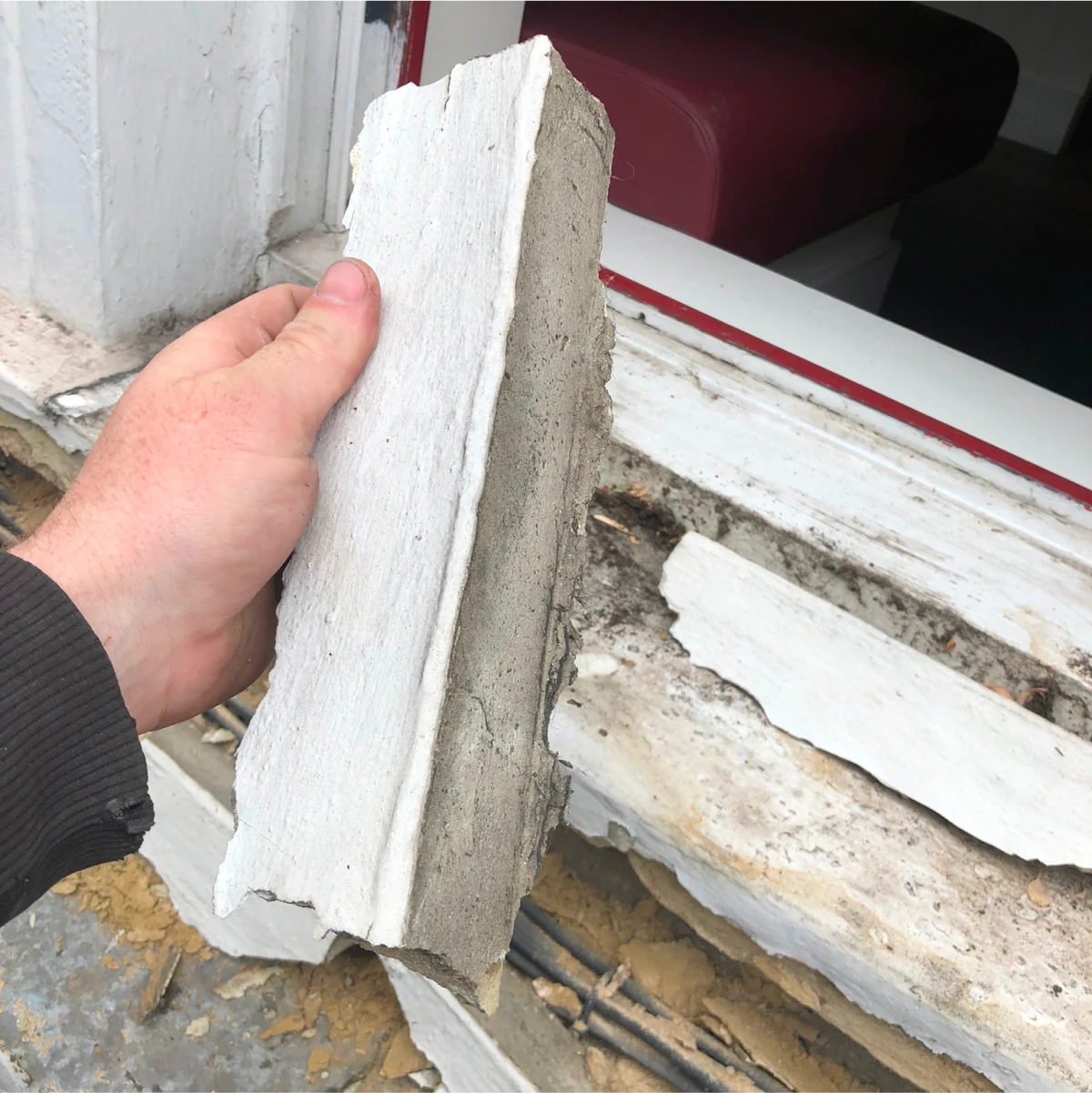 Failed mortar around timber framed window, leading to water ingress and wood decay.