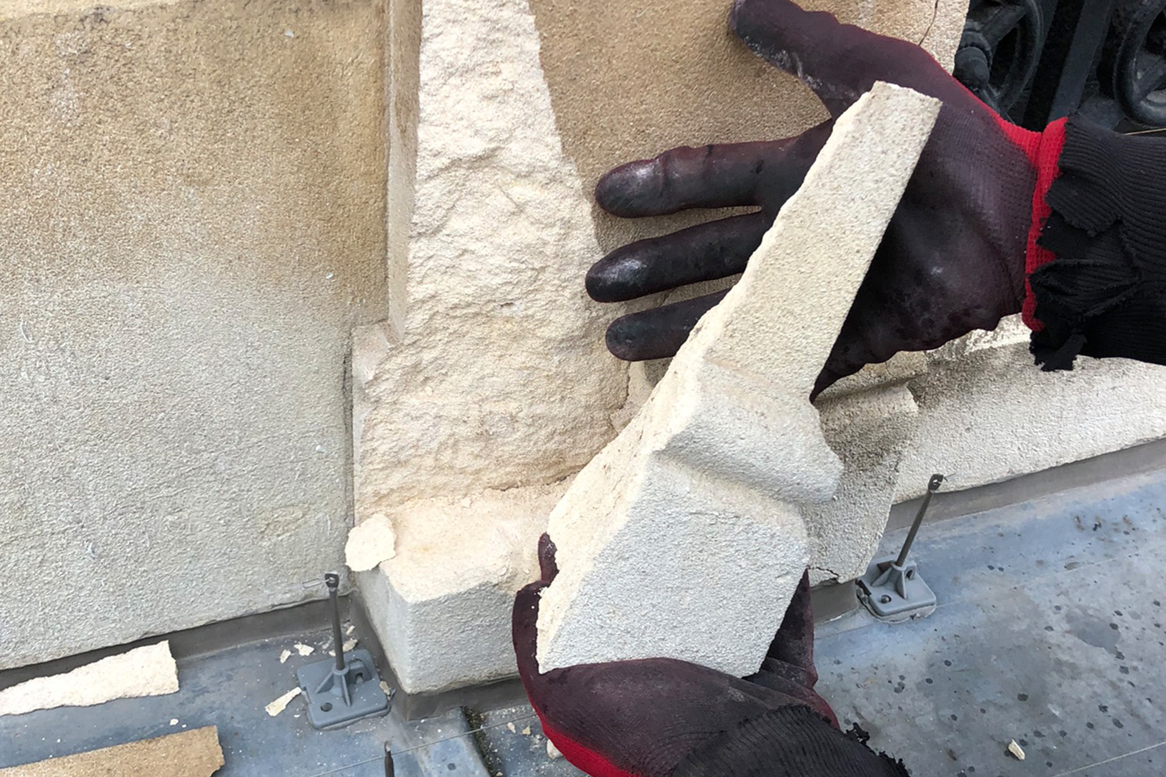 An image of a large chunk of masonry which has come away in the hands of a Thomann-Hanry® façade survey expert.