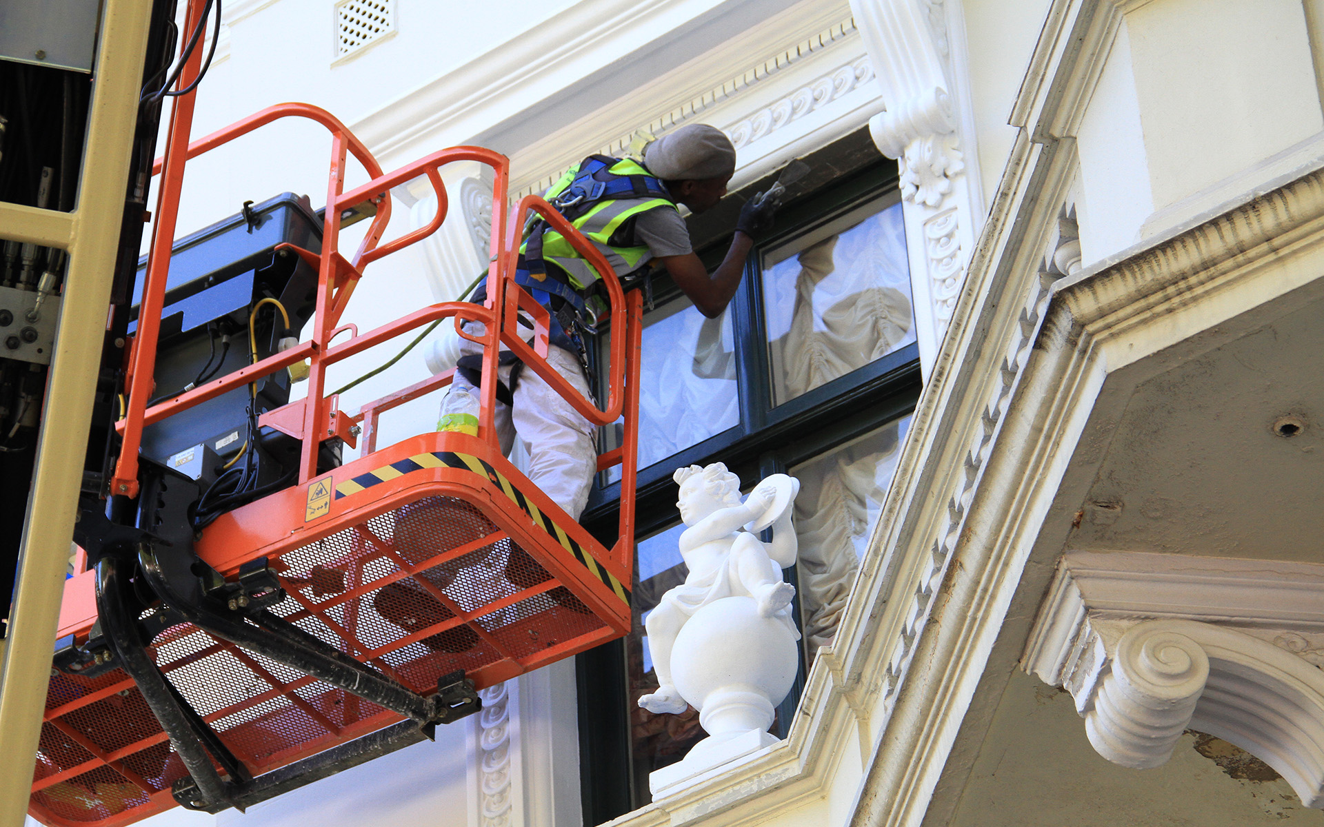 Thomann-Hanry® staff member preparing a window frame for painting